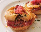 Foto del paso 6 de la receta: Pincho de langostinos  con piquillos caramelizados