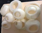 A picture of step 2 of Parmesan breaded onion rings.