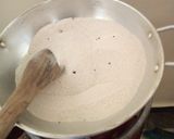 A picture of step 1 of Roasted ground nuts in a salted pan.