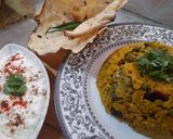 A picture of step 4 of Kathyawadi masala vegetable khichadi with masala curd, papad and 🌶.