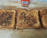 A picture of step 5 of Garlic Brown Bread with peri peri masala Dominos style sticks.