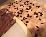 A picture of step 5 of Cinnabon with raisins.