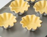 A picture of step 11 of Mini Flower-Shaped Portuguese Egg Tarts with Puff Pastry.