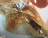 A picture of step 6 of Leftovers: Lamb and Bean Burrito and a Puddle of Hot Sauce.