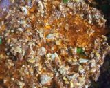 A picture of step 9 of Brain Masalah with tomatoes.