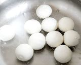 A picture of step 4 of Sweet Rice Wine Sesame Dumplings.