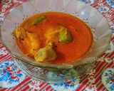 A picture of step 10 of Achari chicken.