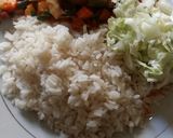 A picture of step 2 of White rice and carrot sauce with cos low.