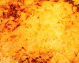 A picture of step 6 of Pork chops with potatoes in the oven.