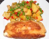A picture of step 2 of Chicken Breast Stuffed with Ham and Cheese. Peas and Potatoes.