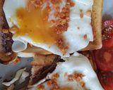 A picture of step 2 of My Simple Fried Egg on Toast with Bacon Crisps and Tomatoes. 😘.