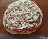Foto del paso 10 de la receta Pizza Extra Fina con Pollo un Poco de Especias y Queso