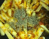 A picture of step 4 of Tawa masala fries.