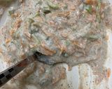 A picture of step 2 of Curd sandwich 🥪/cucumber/carrot mix with curd.