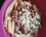 A picture of step 8 of Chicken loaded fries.