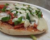 A picture of step 2 of Kulcha pizza on tawa.