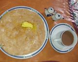 A picture of step 8 of Karara Khasta Paratha with butter and Tea 🍵.