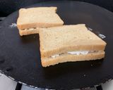 A picture of step 3 of Chilli Cheese Toast on tawa.