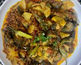 A picture of step 9 of Achari Aloo Baingan.