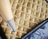 Foto del paso 5 de la receta: Coca de San Juan de Naranja confitada, crema pastelera y piñones