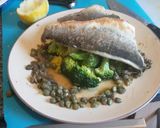 A picture of step 12 of Pan fried seabass fillets on a bed of citrus broccoli.