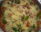 A picture of step 3 of Roti pizza(leftover chapati).