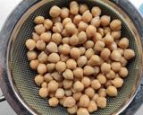 A picture of step 1 of Farro Salad with Chickpeas, Olives, and Walnut Basil Pesto.