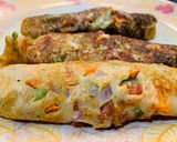 A picture of step 8 of Oats chilla/utappam rolls.