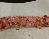 A picture of step 7 of Roast Pork Tenderloin wrapped with Pastrami and served with a Romano / Marscapone Cream Sauce.