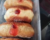 A picture of step 8 of Pillow doughnuts with white line.