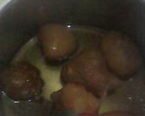A picture of step 5 of Kaimati coated with sugar syrup.