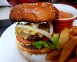A picture of step 7 of My Chilli Burger with lots of toppings 😘.