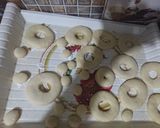 A picture of step 3 of Chocolate Donuts filled with custard.
