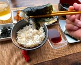 A picture of step 6 of Japanese Breakfast (how to eat Nori seaweed and rice).