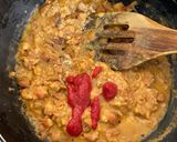 A picture of step 2 of Spicy Fava Beans with burger bun.