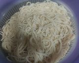 A picture of step 1 of American chopsuey with fried rice.