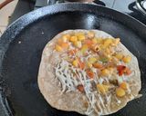 A picture of step 5 of Mexican cheesy quesadilla.