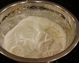 A picture of step 14 of White Peppermint Layer Cake with a White Peppermint Cream.