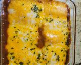 A picture of step 11 of Bourbon barbecue chicken lasagna roll ups.