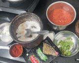 A picture of step 1 of Bowtie red jain sauce pasta.
