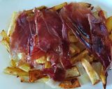 Foto del paso 2 de la receta Patatas fritas en el horno con jamón y huevos