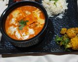 A picture of step 4 of Handi paneer with boiled rice, aloo gobhi and salad.