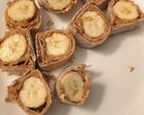 A picture of step 4 of Peanut Butter Banana Roll Up.