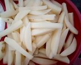 A picture of step 1 of Schezwan Chilli Potatoes with Jeera Rice.