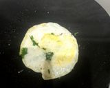 A picture of step 5 of Omelette with green coriander 🥚🥬🥬.