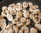 A picture of step 1 of Buttered Mushrooms in a little white wine and Balsamic Vinegar.