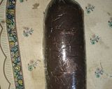 A picture of step 8 of Chocolate and biscuit salami.