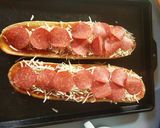 A picture of step 5 of Garlic bread pizza.