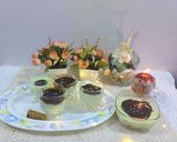 A picture of step 5 of Pista custard pudding with almond chocolate pudding.