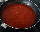 Foto del paso 6 de la receta Manitas de cerdo con tomate, jamón y morro